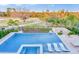 Inviting pool area featuring a spa and three lounge chairs overlooking a meticulously kept green space at 480 Muirfield Loop, Reunion, FL 34747