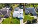 Aerial view of home with well-maintained lawn, screened in pool and additional building; outlined in red at 4826 S Saint Brides Cir, Orlando, FL 32812