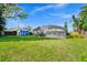 Expansive backyard featuring a screened-in pool area and a storage shed, offering ample space for recreation at 4826 S Saint Brides Cir, Orlando, FL 32812