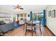 Bright living room with sliding glass doors to the pool area, and a ceiling fan at 4826 S Saint Brides Cir, Orlando, FL 32812