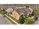 Aerial view of well maintained townhomes, lush green landscaping, and paved walkways at 5095 Caspian St, St Cloud, FL 34771