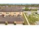 Aerial view of the townhome showcasing the rear patio area and well-manicured landscaping at 5095 Caspian St, St Cloud, FL 34771