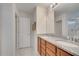 Double vanity bathroom with stone counters, tile floors, and a shower at 5095 Caspian St, St Cloud, FL 34771