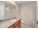 Bathroom features a granite countertop, wood cabinets and tiled floors at 5095 Caspian St, St Cloud, FL 34771