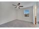 Bright bedroom with a ceiling fan and a window for natural light at 5095 Caspian St, St Cloud, FL 34771