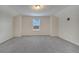 Spacious bedroom with neutral carpet, a window, and neutral walls creating a peaceful retreat at 5095 Caspian St, St Cloud, FL 34771