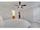 Bedroom with a ceiling fan and access to an ensuite bathroom at 5095 Caspian St, St Cloud, FL 34771