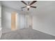 A bright bedroom with neutral carpet and access to closets and bathroom at 5095 Caspian St, St Cloud, FL 34771