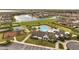 Aerial shot of a community with a pool, clubhouse, playground, and basketball court at 5095 Caspian St, St Cloud, FL 34771