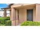 Close-up shot of townhome featuring covered front porch, and manicured landscaping at 5095 Caspian St, St Cloud, FL 34771