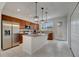 Well-equipped kitchen with stainless steel appliances, granite countertops, and stylish pendant lighting at 5095 Caspian St, St Cloud, FL 34771