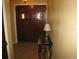 Inviting foyer featuring a double wooden door, decorative lamp and neutral walls at 5121 Hoperita St, Orlando, FL 32812