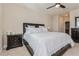 Relaxing bedroom featuring a king-size bed, neutral decor, and ample natural light at 7517 Laureate Blvd # 4103, Orlando, FL 32827