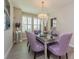 Chic dining room with a unique table setting and contemporary lighting at 7517 Laureate Blvd # 4103, Orlando, FL 32827