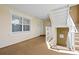 Hallway with a window, staircase, and doors for access to the various condo units at 7651 Whisper Way # 204, Reunion, FL 34747