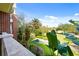 View from the patio showcasing the lush trees, green lawns, and walkways around the community at 7651 Whisper Way # 204, Reunion, FL 34747