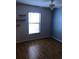 Bedroom with wood-look floors, a ceiling fan, and a window with blinds at 7706 Country Pl # 7706, Winter Park, FL 32792