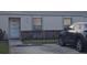Charming condo with well-maintained landscaping, front door, parking space, and a dark gray SUV at 7706 Country Pl # 7706, Winter Park, FL 32792