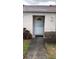 Front door with storm door and house number in a well-maintained neighborhood at 7706 Country Pl # 7706, Winter Park, FL 32792