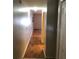 Hallway featuring wood-look floors, and a closet at 7706 Country Pl # 7706, Winter Park, FL 32792