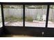 Screened-in porch with view of fenced-in yard at 7706 Country Pl # 7706, Winter Park, FL 32792