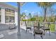 Charming outdoor patio with elegant furniture, offering a serene space for relaxation and entertainment at 807 Oak Shadows Rd, Celebration, FL 34747