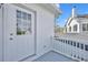 This balcony has a door, white railings and exterior view of roof and siding at 807 Oak Shadows Rd, Celebration, FL 34747