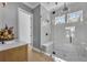 Bathroom showcasing a glass-enclosed shower with seating and modern fixtures at 807 Oak Shadows Rd, Celebration, FL 34747