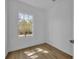 This simple bedroom with wood floors and natural light is ready for relaxation at 807 Oak Shadows Rd, Celebration, FL 34747