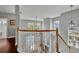 Bright foyer with a view of the open living space, featuring hardwood floors and a staircase at 807 Oak Shadows Rd, Celebration, FL 34747