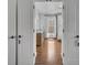 Hallway view of bathroom with hardwood flooring at 807 Oak Shadows Rd, Celebration, FL 34747