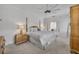 Spacious main bedroom showcasing neutral tones, a ceiling fan, and elegant furnishings at 807 Oak Shadows Rd, Celebration, FL 34747