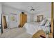 Serene main bedroom with a ceiling fan, ample natural light, and stylish furnishings at 807 Oak Shadows Rd, Celebration, FL 34747