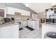 Bright kitchen featuring white cabinetry, granite countertops, and stainless steel appliances at 1043 Meller Way, Orlando, FL 32825