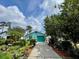 Charming home showcasing a vibrant exterior and lush landscaping at 11213 River Grove Dr, Orlando, FL 32817