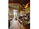 Inviting living area featuring wood-paneled walls, a cozy bed, and a dining table with chairs at 11213 River Grove Dr, Orlando, FL 32817