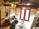 Bright living room featuring high ceilings, wood beams, and a ceiling fan at 11213 River Grove Dr, Orlando, FL 32817