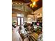 Inviting living area featuring wood-paneled walls, a cozy bed, and a dining table with chairs at 11213 River Grove Dr, Orlando, FL 32817