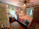 Cozy main bedroom with warm lighting and a comfortable bed at 11213 River Grove Dr, Orlando, FL 32817