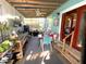 Relaxing porch with bright blue wall, ceiling fan, and a mix of seating areas at 11213 River Grove Dr, Orlando, FL 32817