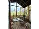 Relaxing screened porch featuring a seating area, plants, and outdoor views at 11213 River Grove Dr, Orlando, FL 32817
