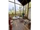 Screened porch with lattice trim and outdoor view, furnished with a seating area at 11213 River Grove Dr, Orlando, FL 32817