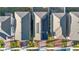 Aerial view of rooftops with one house having solar panels installed at 1129 Blue Garden Dr, Deland, FL 32720