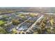 Expansive aerial view of new construction community surrounded by preserved nature and future amenities at 1129 Blue Garden Dr, Deland, FL 32720