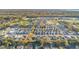 Planned community aerial featuring diverse home styles, green spaces, and walking trails in a scenic location at 1129 Blue Garden Dr, Deland, FL 32720