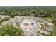 Birds eye view of community pool and playground surrounded by residential homes at 1129 Blue Garden Dr, Deland, FL 32720