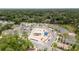 Aerial view of community pool and playground surrounded by single Gathering homes at 1129 Blue Garden Dr, Deland, FL 32720