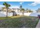 Fenced backyard featuring a large grassy area perfect for outdoor activities and landscaping at 1129 Blue Garden Dr, Deland, FL 32720
