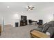 Finished basement area with a television, fireplace, and comfortable seating, perfect for relaxation at 1129 Blue Garden Dr, Deland, FL 32720