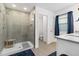 Modern bathroom features a glass shower stall, tile floors, and a separate room for the toilet at 1129 Blue Garden Dr, Deland, FL 32720